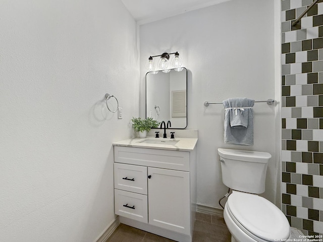 4015 Ramsgate, San Antonio, TX 78230 - bathroom featuring tile patterned floors, toilet, baseboards, and vanity