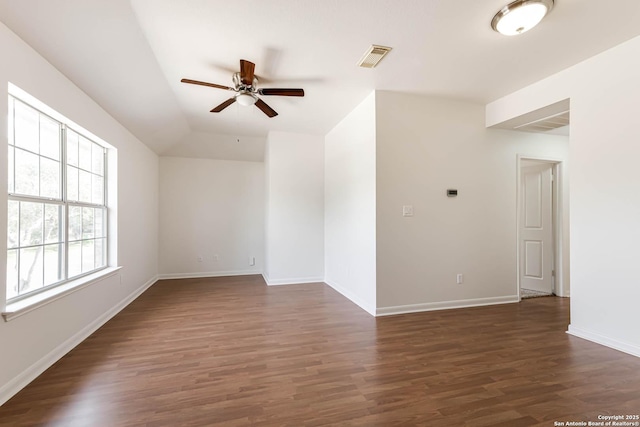21746 Luisa, San Antonio, TX 78259 - spare room with a ceiling fan, dark wood-type flooring, baseboards, and vaulted ceiling