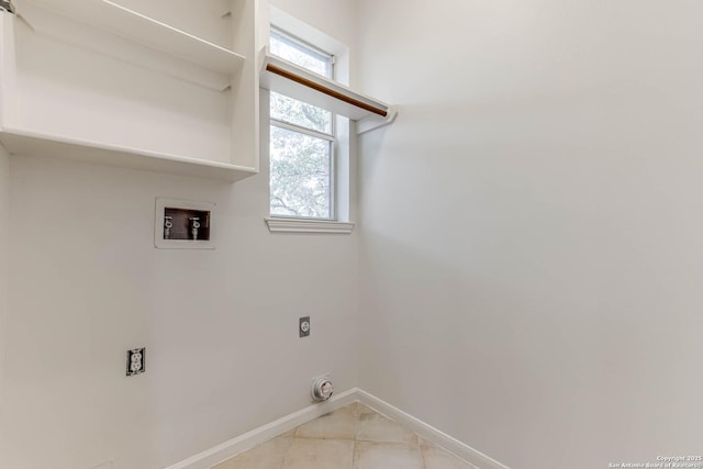 21746 Luisa, San Antonio, TX 78259 - laundry area with hookup for an electric dryer, baseboards, washer hookup, and light tile patterned floors