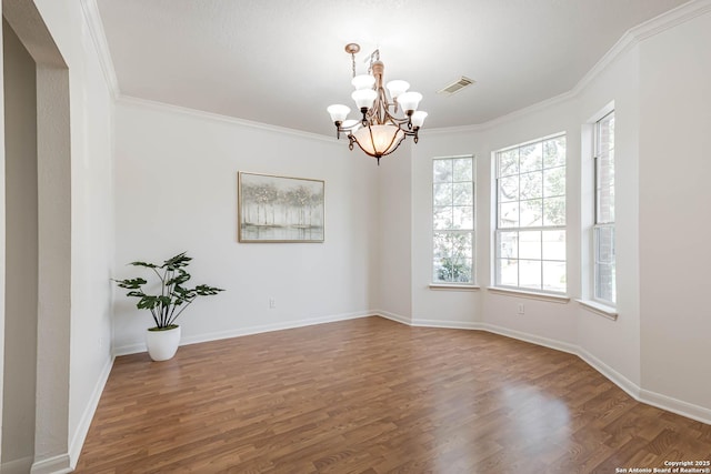 21746 Luisa, San Antonio, TX 78259 - empty room featuring a chandelier, wood finished floors, crown molding, and baseboards