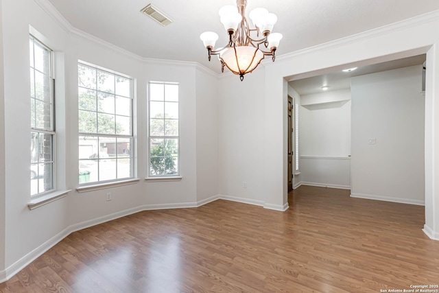 21746 Luisa, San Antonio, TX 78259 - unfurnished room with a chandelier, wood finished floors, baseboards, and crown molding