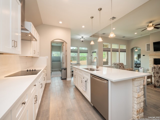 1006 Rock Shelter, San Antonio, TX 78260 - kitchen with dishwasher, arched walkways, a sink, black electric cooktop, and recessed lighting