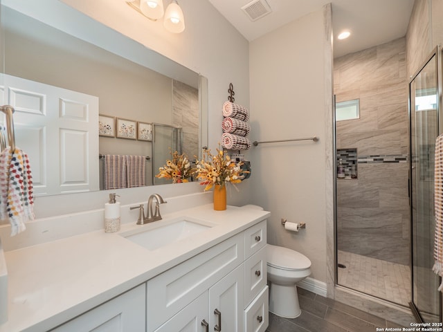 1006 Rock Shelter, San Antonio, TX 78260 - full bathroom featuring toilet, a shower stall, vanity, wood finished floors, and baseboards