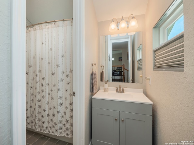 1006 Rock Shelter, San Antonio, TX 78260 - bathroom featuring vanity, curtained shower, and a textured wall