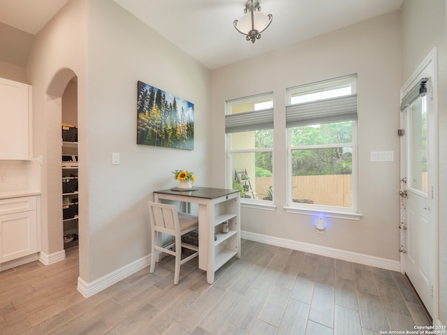 1006 Rock Shelter, San Antonio, TX 78260 - dining area featuring arched walkways, light wood-style flooring, and baseboards