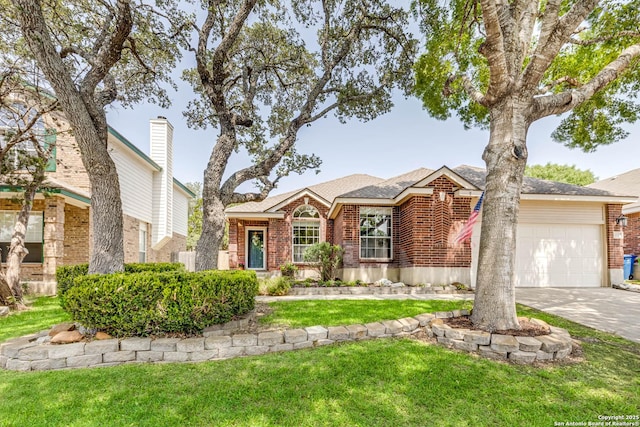 20315 Grail Quest, San Antonio, TX 78258 - view of front of house featuring brick siding, an attached garage, concrete driveway, and a front lawn