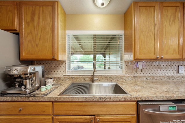 11301 Ford, Adkins, TX 78101 - kitchen with a sink, stainless steel dishwasher, light countertops, and backsplash