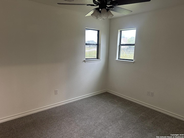 185 Quail Valley Dr, Bandera, TX 78003 - unfurnished room featuring a ceiling fan, baseboards, and dark carpet