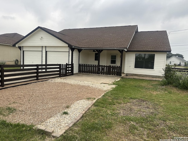 185 Quail Valley Dr, Bandera, TX 78003 - view of front of property with an attached garage, concrete driveway, and roof with shingles