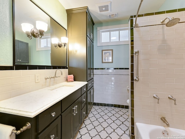 207 Queen Anne, San Antonio, TX 78209 - bathroom featuring vanity, tile walls, bathtub / shower combination, and tile patterned flooring