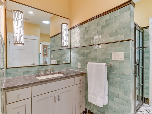 207 Queen Anne, San Antonio, TX 78209 - bathroom with tile walls, vanity, and a shower stall