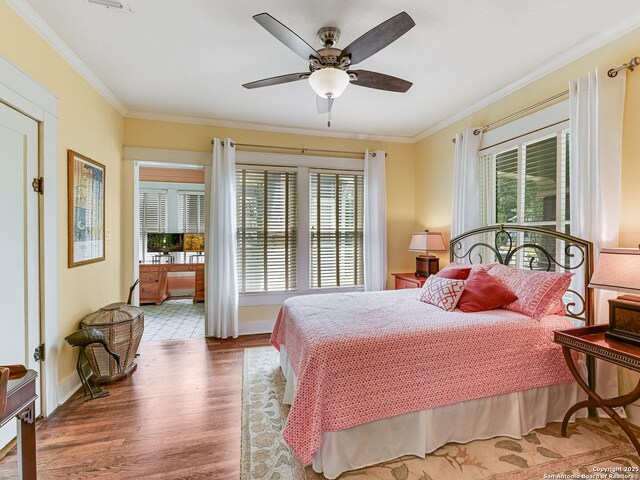 207 Queen Anne, San Antonio, TX 78209 - bedroom with wood finished floors, ornamental molding, baseboards, and ceiling fan