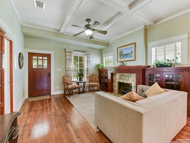 207 Queen Anne, San Antonio, TX 78209 - living room with wood finished floors, coffered ceiling, a stone fireplace, beamed ceiling, and ceiling fan