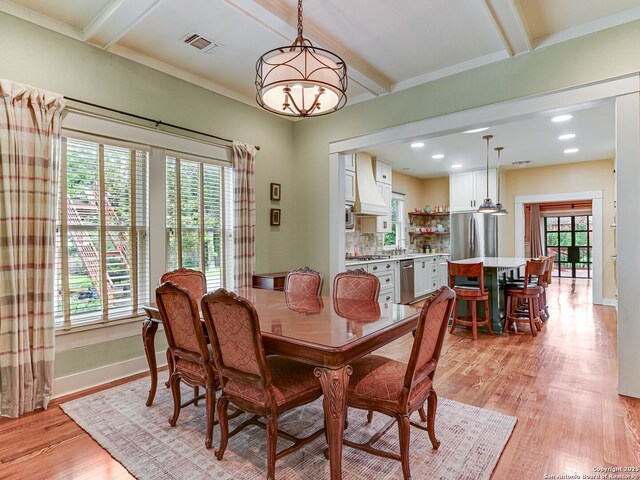 207 Queen Anne, San Antonio, TX 78209 - dining space featuring plenty of natural light, light wood-style flooring, baseboards, beam ceiling, and recessed lighting