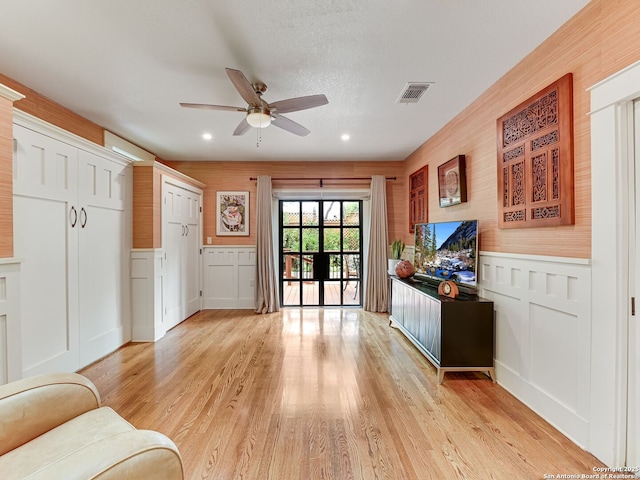 207 Queen Anne, San Antonio, TX 78209 - entryway featuring a ceiling fan, a decorative wall, light wood finished floors, recessed lighting, and a wainscoted wall