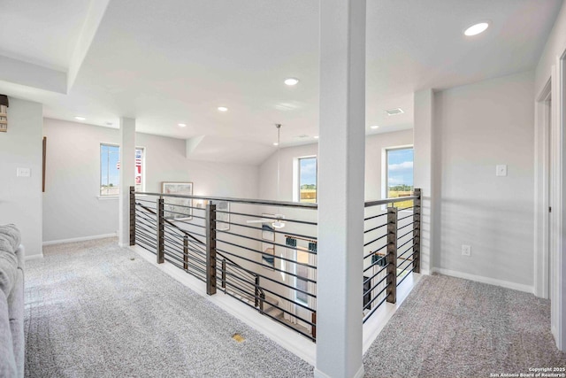 8644 Merlin Cv, San Antonio, TX 78222 - corridor with carpet floors, an upstairs landing, baseboards, and recessed lighting