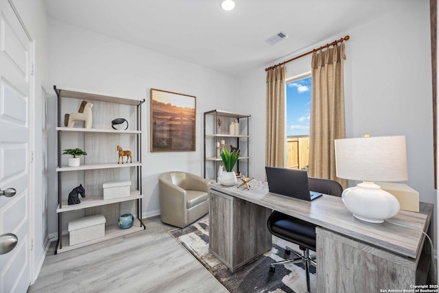 8644 Merlin Cv, San Antonio, TX 78222 - office area with wood finished floors and baseboards