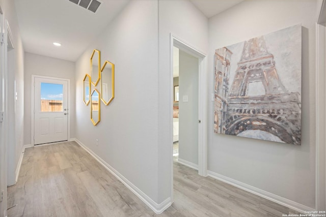 8644 Merlin Cv, San Antonio, TX 78222 - corridor with light wood-type flooring, baseboards, and recessed lighting