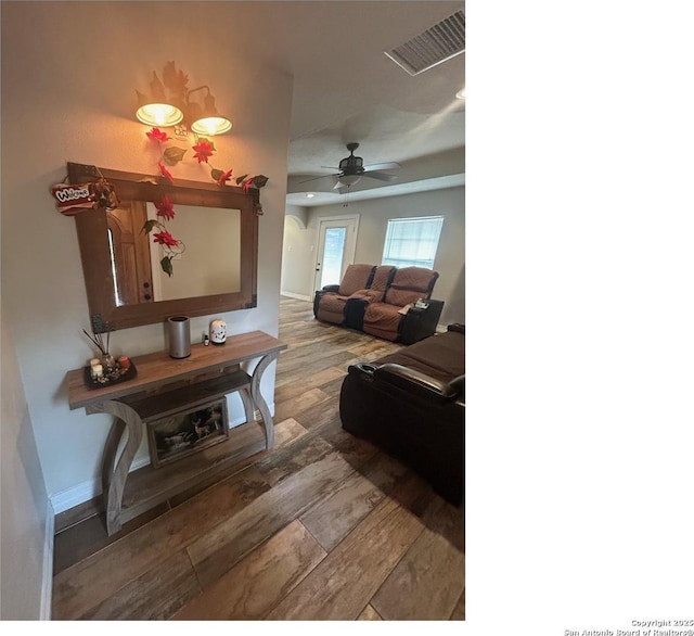 1924 Owens Ave, Groves, TX 77619 - living room with wood finished floors, a ceiling fan, baseboards, and arched walkways