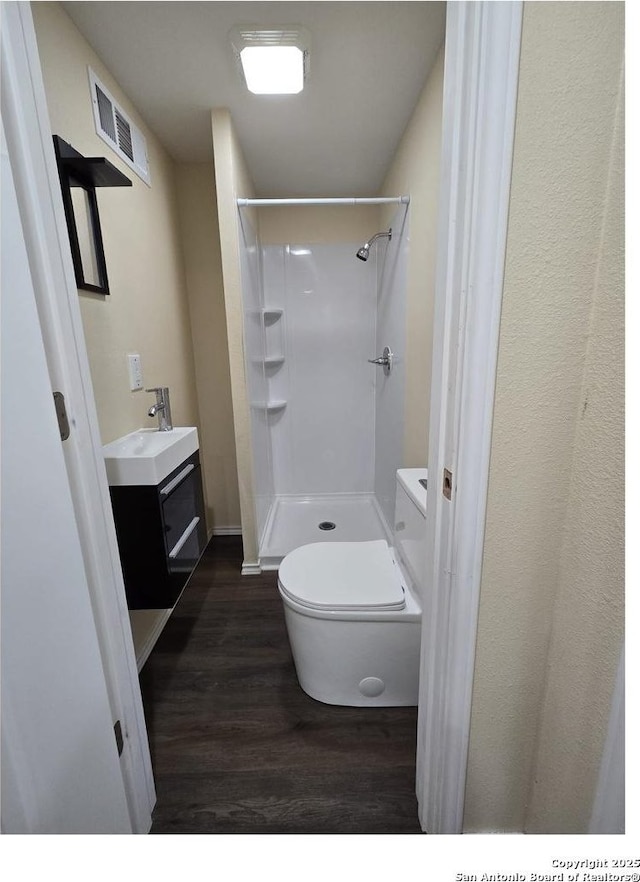 1924 Owens Ave, Groves, TX 77619 - full bath with wood finished floors, toilet, a shower, and vanity