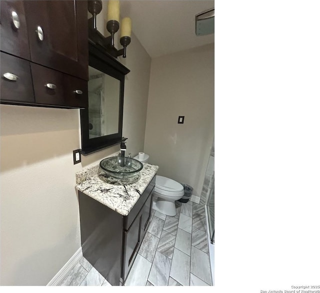 1924 Owens Ave, Groves, TX 77619 - half bath with toilet, vanity, and baseboards