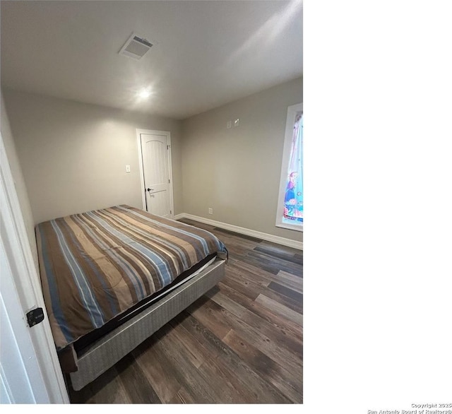 1924 Owens Ave, Groves, TX 77619 - bedroom featuring dark wood-style floors, baseboards, and recessed lighting