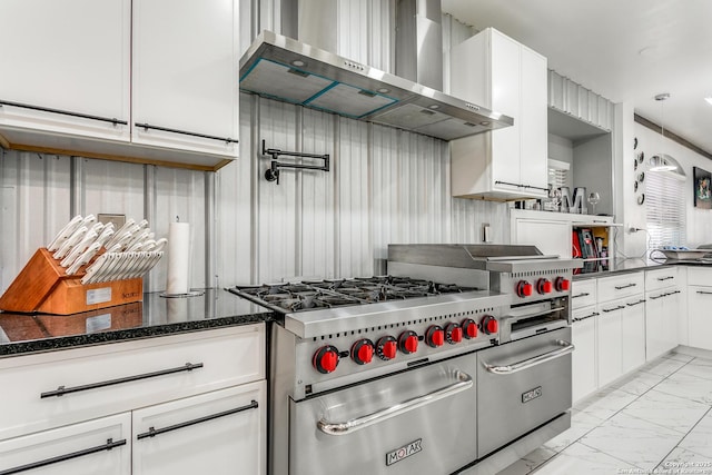 1002 Alpine Pond, San Antonio, TX 78260 - kitchen with wall chimney range hood, light marble finish floors, double oven range, white cabinets, and dark stone counters