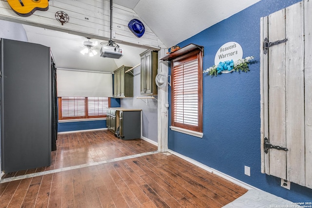 1002 Alpine Pond, San Antonio, TX 78260 - garage with a textured wall, baseboards, and a garage door opener
