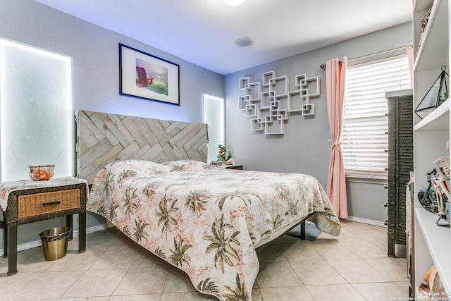 1002 Alpine Pond, San Antonio, TX 78260 - bedroom featuring light tile patterned floors and baseboards
