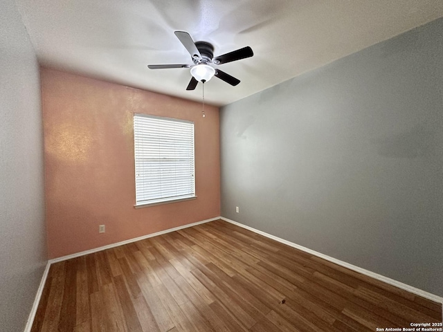 4835 Castle Sword, San Antonio, TX 78218 - unfurnished room with wood finished floors, baseboards, and ceiling fan