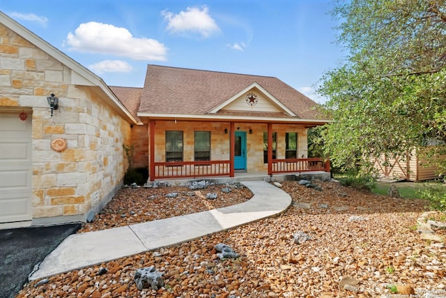 1831 Birch Ln, Fischer, TX 78623 - view of front facade featuring covered porch, roof with shingles, and stone siding