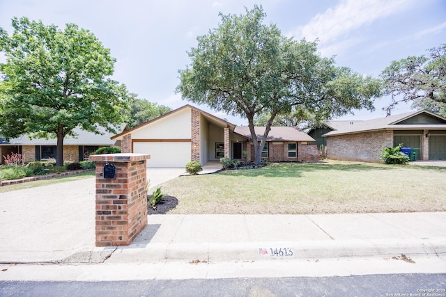 14613 Hook Dr, San Antonio, TX 78231 - mid-century modern home featuring an attached garage, a front lawn, and concrete driveway