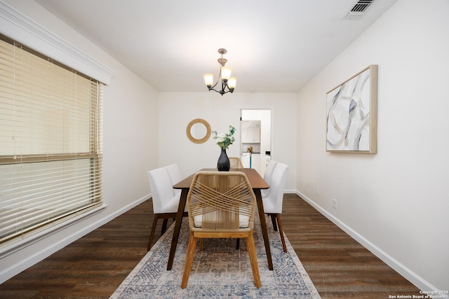 14613 Hook Dr, San Antonio, TX 78231 - dining space featuring a chandelier, wood finished floors, and baseboards