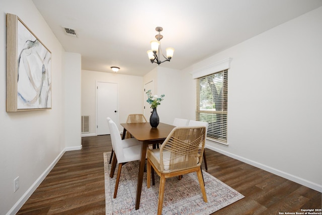 14613 Hook Dr, San Antonio, TX 78231 - dining area featuring dark wood-type flooring, a chandelier, and baseboards