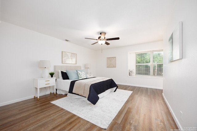 14613 Hook Dr, San Antonio, TX 78231 - bedroom with wood finished floors, baseboards, and a ceiling fan