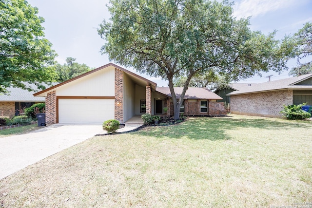 14613 Hook Dr, San Antonio, TX 78231 - mid-century inspired home featuring an attached garage, a front yard, driveway, and brick siding