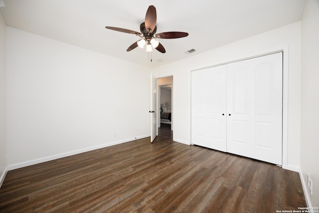 14613 Hook Dr, San Antonio, TX 78231 - unfurnished bedroom with dark wood finished floors, baseboards, a closet, and a ceiling fan
