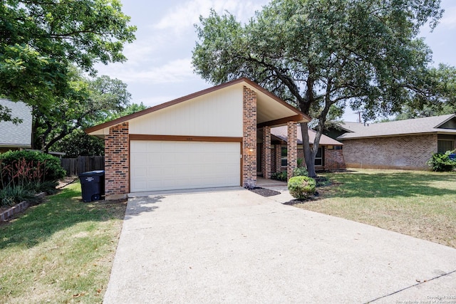 14613 Hook Dr, San Antonio, TX 78231 - mid-century inspired home featuring brick siding, a garage, and concrete driveway