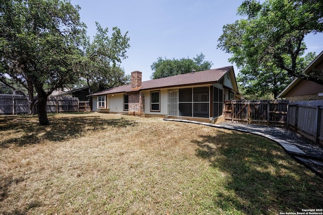 14613 Hook Dr, San Antonio, TX 78231 - back of property with a chimney and a sunroom