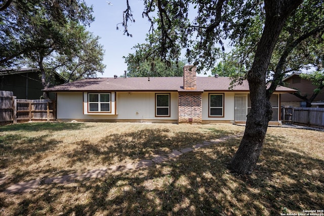 14613 Hook Dr, San Antonio, TX 78231 - back of property with a chimney and brick siding