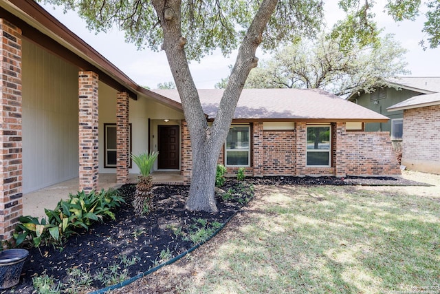 14613 Hook Dr, San Antonio, TX 78231 - view of front of property with brick siding, a front lawn, and a shingled roof