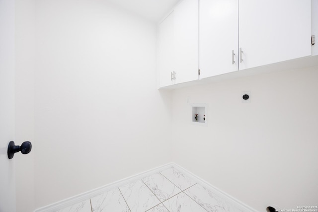 14613 Hook Dr, San Antonio, TX 78231 - laundry room featuring cabinet space, marble look tile flooring, washer hookup, baseboards, and electric dryer hookup