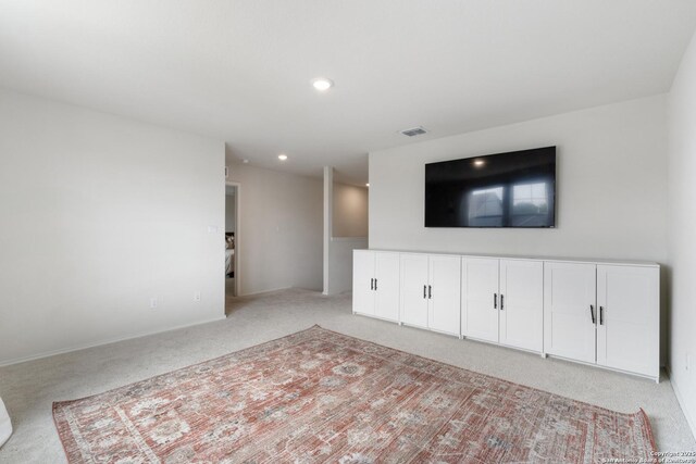 809 Altapass Hls, Seguin, TX 78155 - unfurnished living room with light colored carpet and recessed lighting