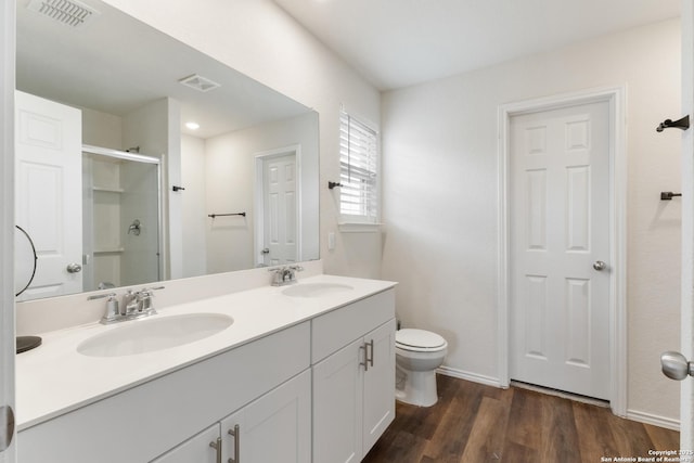 809 Altapass Hls, Seguin, TX 78155 - full bath featuring a shower stall, toilet, wood finished floors, double vanity, and baseboards