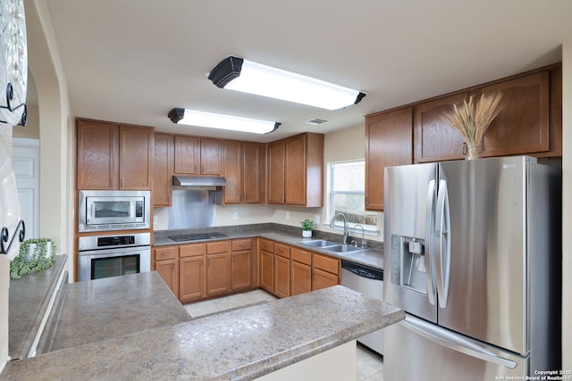 11106 Shetland Hls, San Antonio, TX 78254 - kitchen featuring stainless steel appliances, a sink, under cabinet range hood, and light tile patterned floors