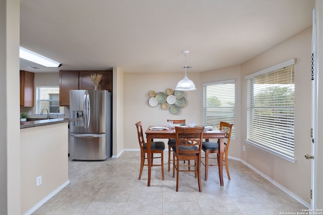 11106 Shetland Hls, San Antonio, TX 78254 - dining space with light tile patterned floors and baseboards