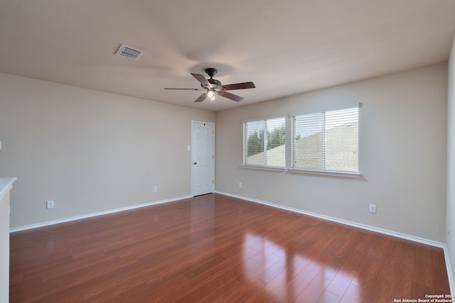 11106 Shetland Hls, San Antonio, TX 78254 - unfurnished room with ceiling fan, baseboards, and dark wood-style floors