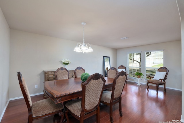 11106 Shetland Hls, San Antonio, TX 78254 - dining area featuring a chandelier, dark wood-type flooring, and baseboards