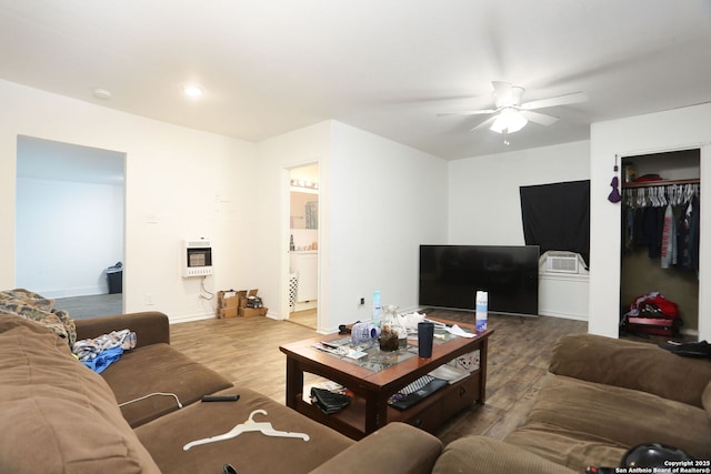 311 W Malone Ave, San Antonio, TX 78214 - living area with heating unit, ceiling fan, wood finished floors, and baseboards
