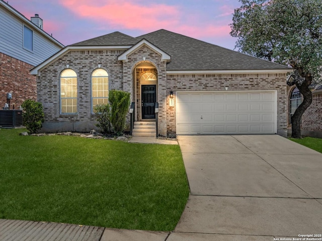 26430 Walden Oak, San Antonio, TX 78260 - view of front of property with brick siding, driveway, a shingled roof, and a front lawn